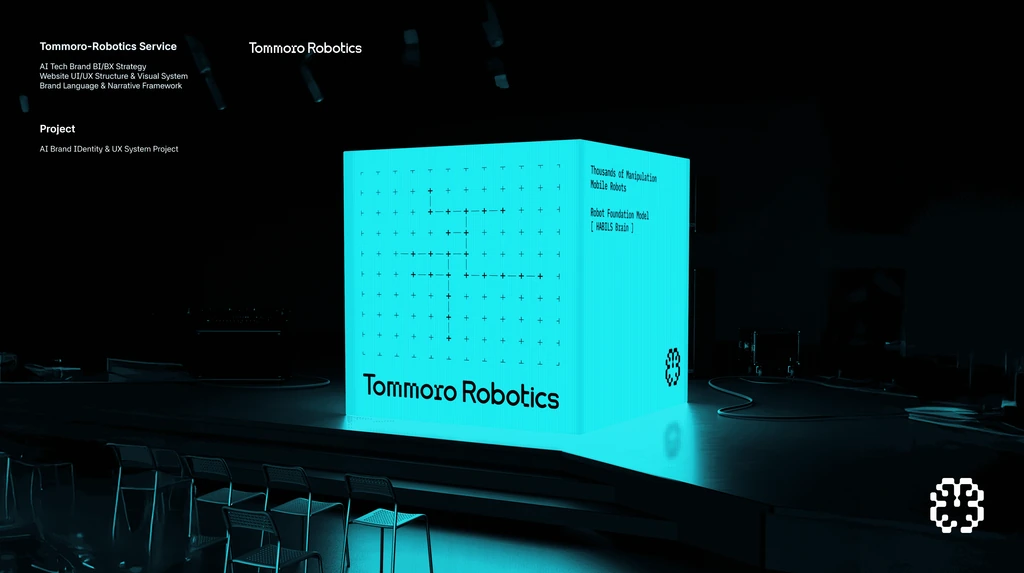 Tommoro Robotics 로고와 문구가 표시된 청록색 큐브